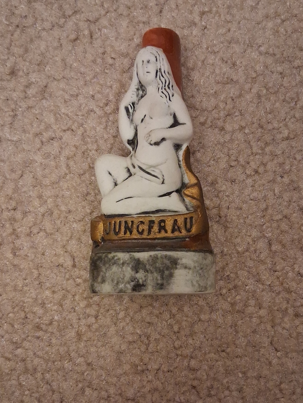 Vintage Figurine with 'JUNGFRAU' Banner